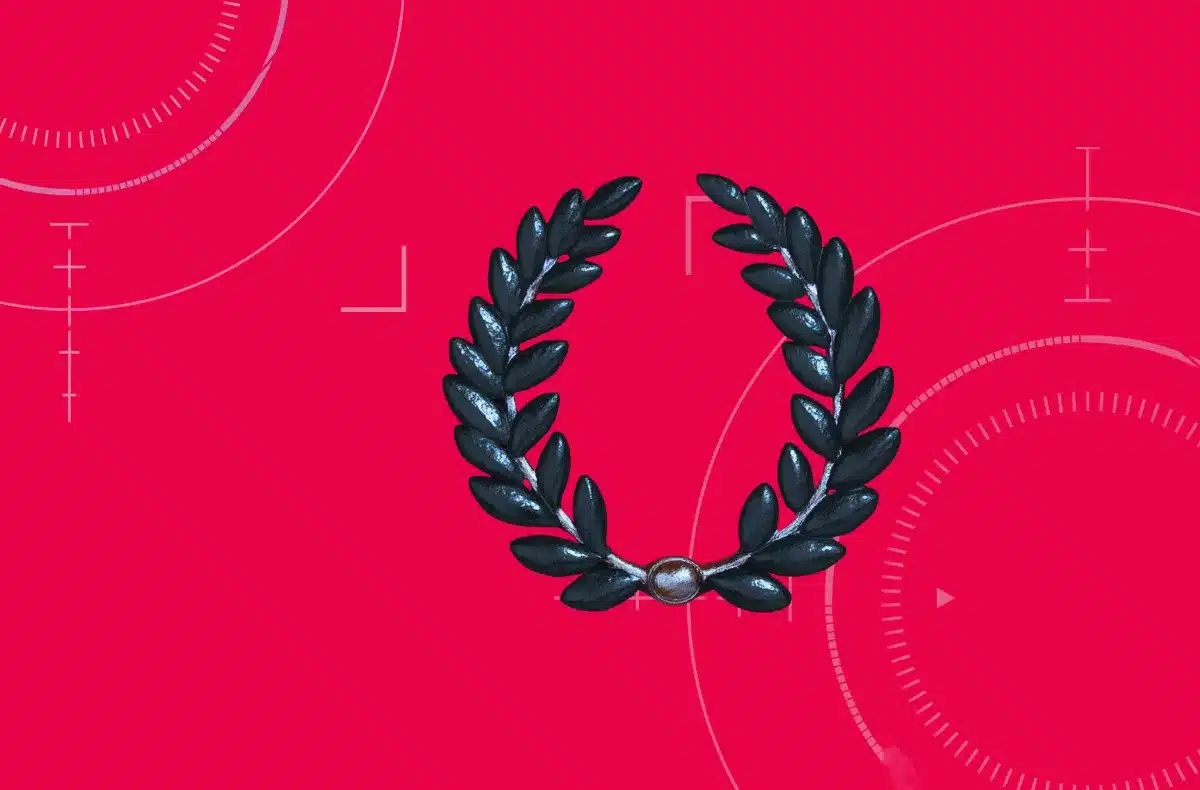 Dark blue laurel wreath on a magenta background representing top B2B leader achievement by Clutch.